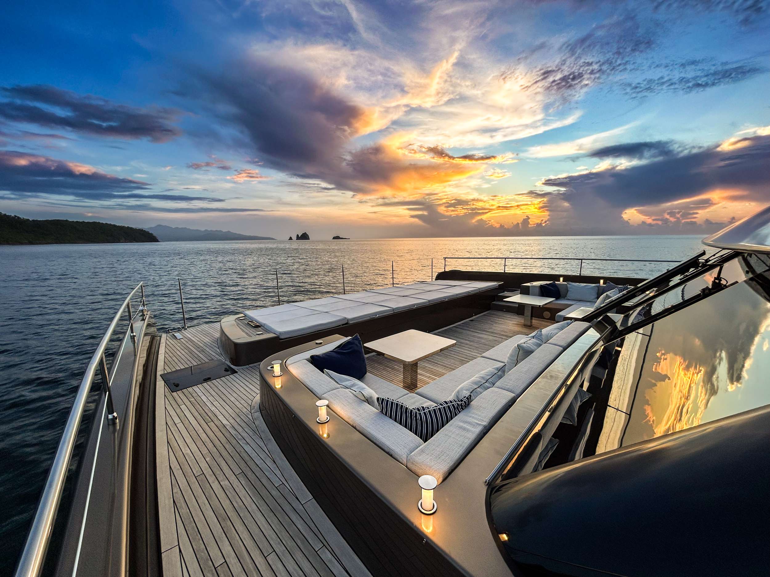 Sunset aboard a crewed yacht charter.