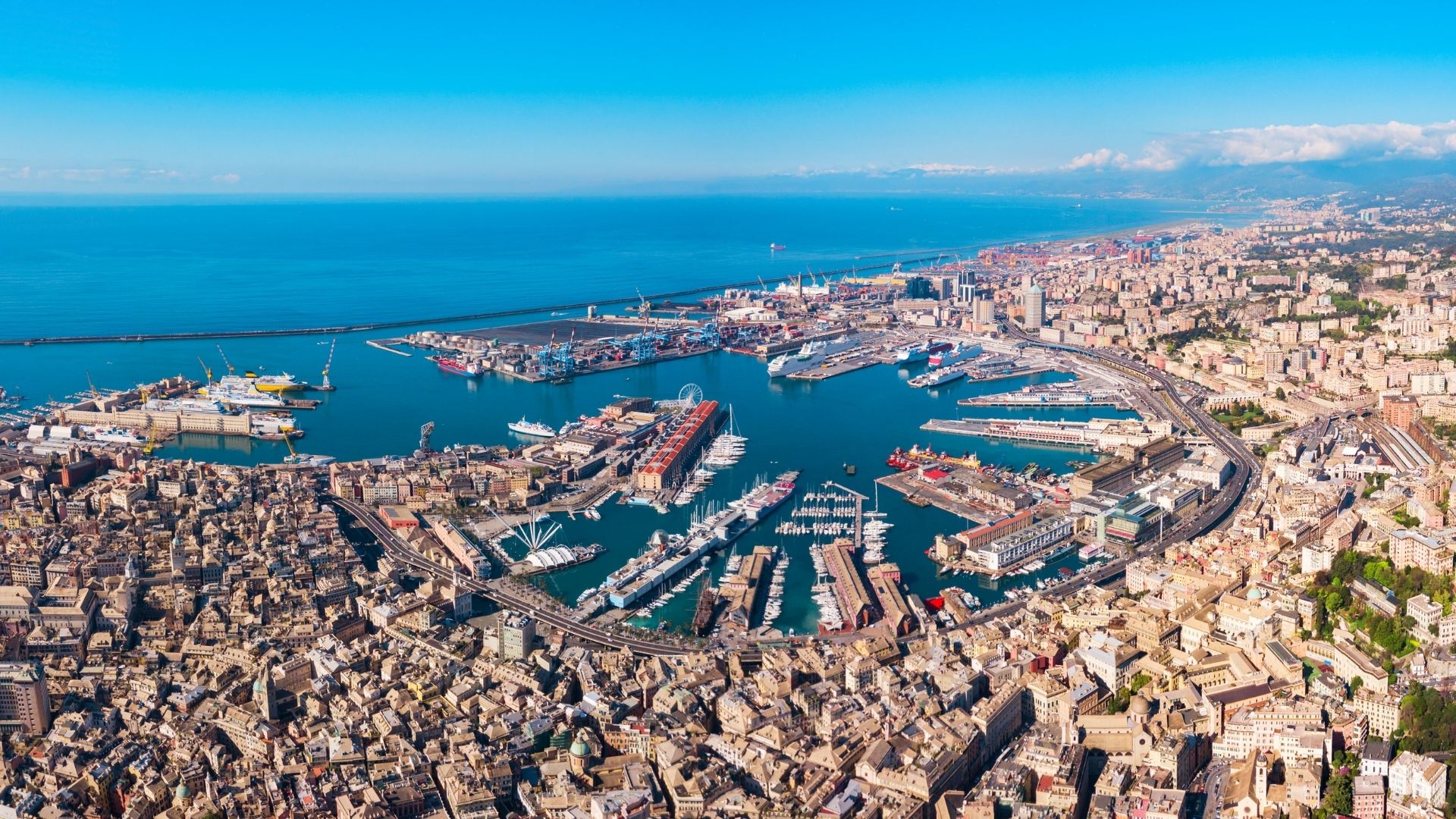 Genoa — the disembarkation gateway and the country's largest commercial port. Direct trains from Genoa Brignole reach Milan in ninety minutes, Rome in four and a half hours, and Nice across the border in two and a half. GOA airport is fifteen minutes from Marina Genoa Aeroporto by car.