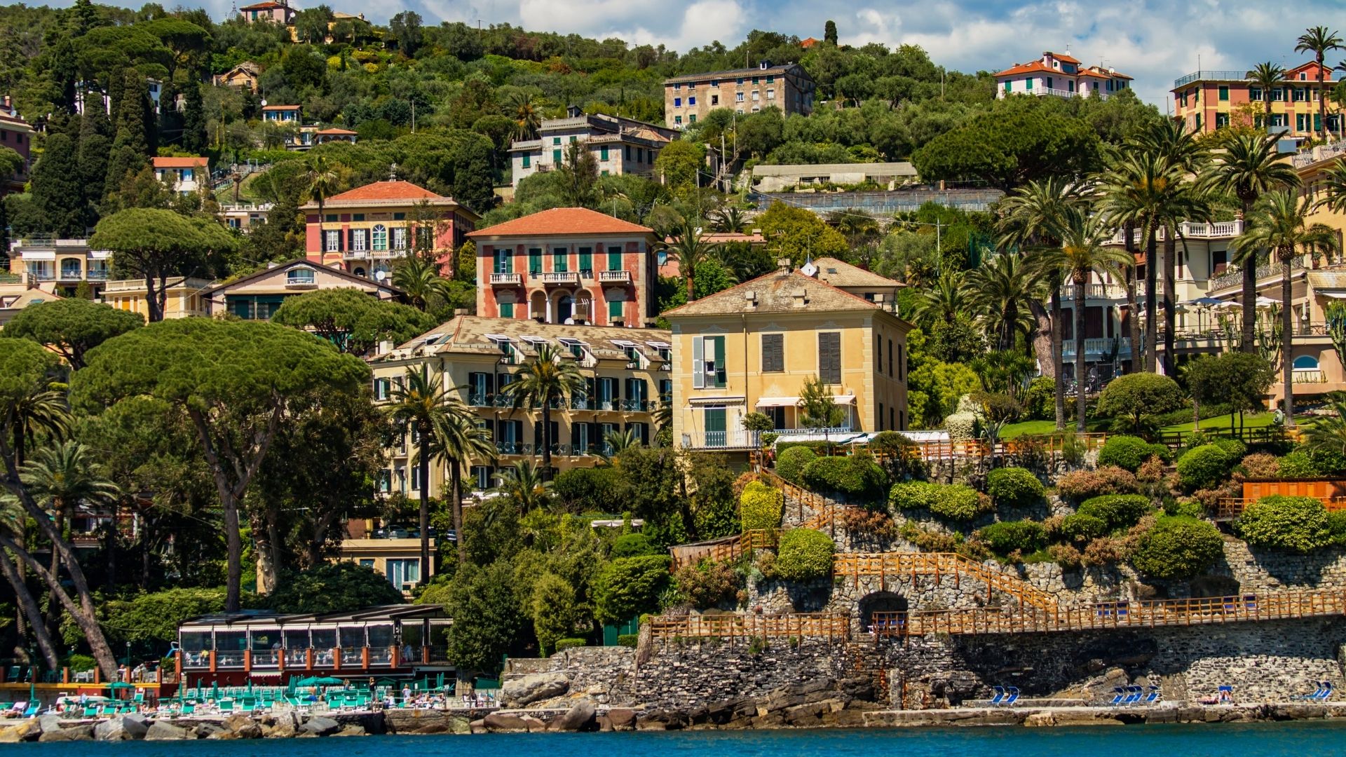 Santa Margherita Ligure across the headland — the larger working harbor at the head of the Gulf of Tigullio. Quieter than Portofino, with the same Ligurian-Belle-Époque facades and better dinner reservations in peak season.