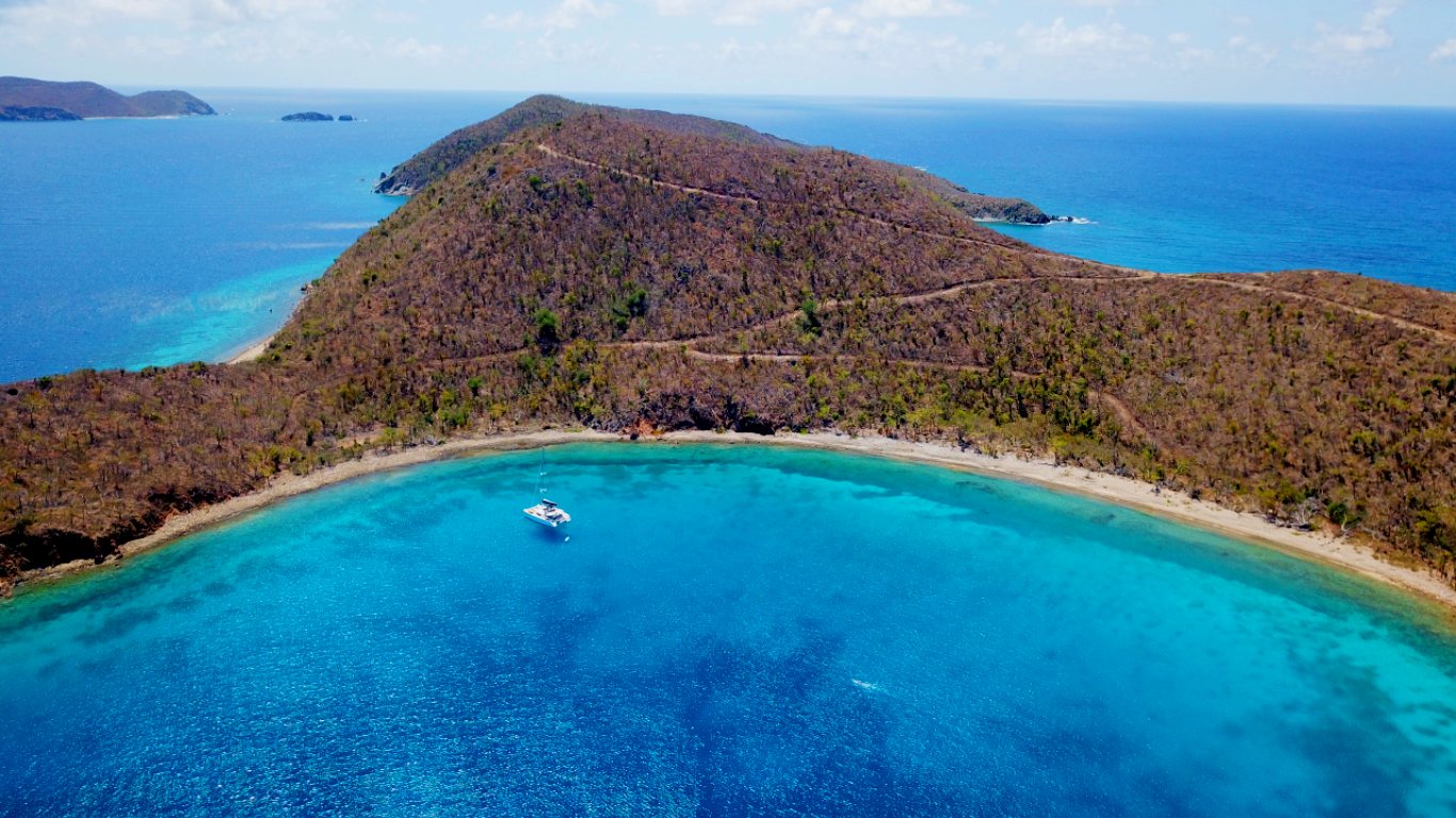 Benures Bay on Norman Island in BVI, a serene spot ideal for snorkeling and enjoying unspoiled nature.