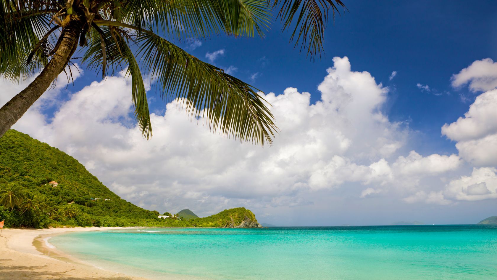 Smugglers Cove in Tortola, BVI, a secluded beach paradise ideal for snorkeling , escaping crowds, and a rustic beach bar experience.