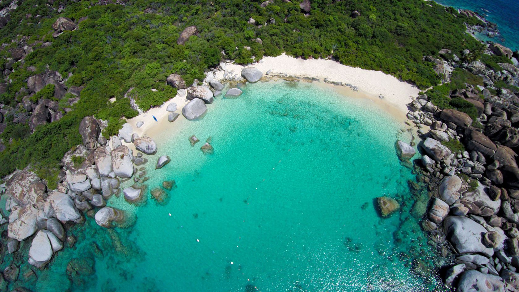 Discover Devil's Bay, Virgin Gorda: A beautiful, serene beach perfect for swimming and snorkeling. Accessible via a scenic hike from The Baths.