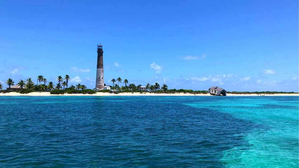 Loggerhead Key invites adventurers to its lighthouse, coral reefs, Little Africa, the legendary Windjammer Wreck.