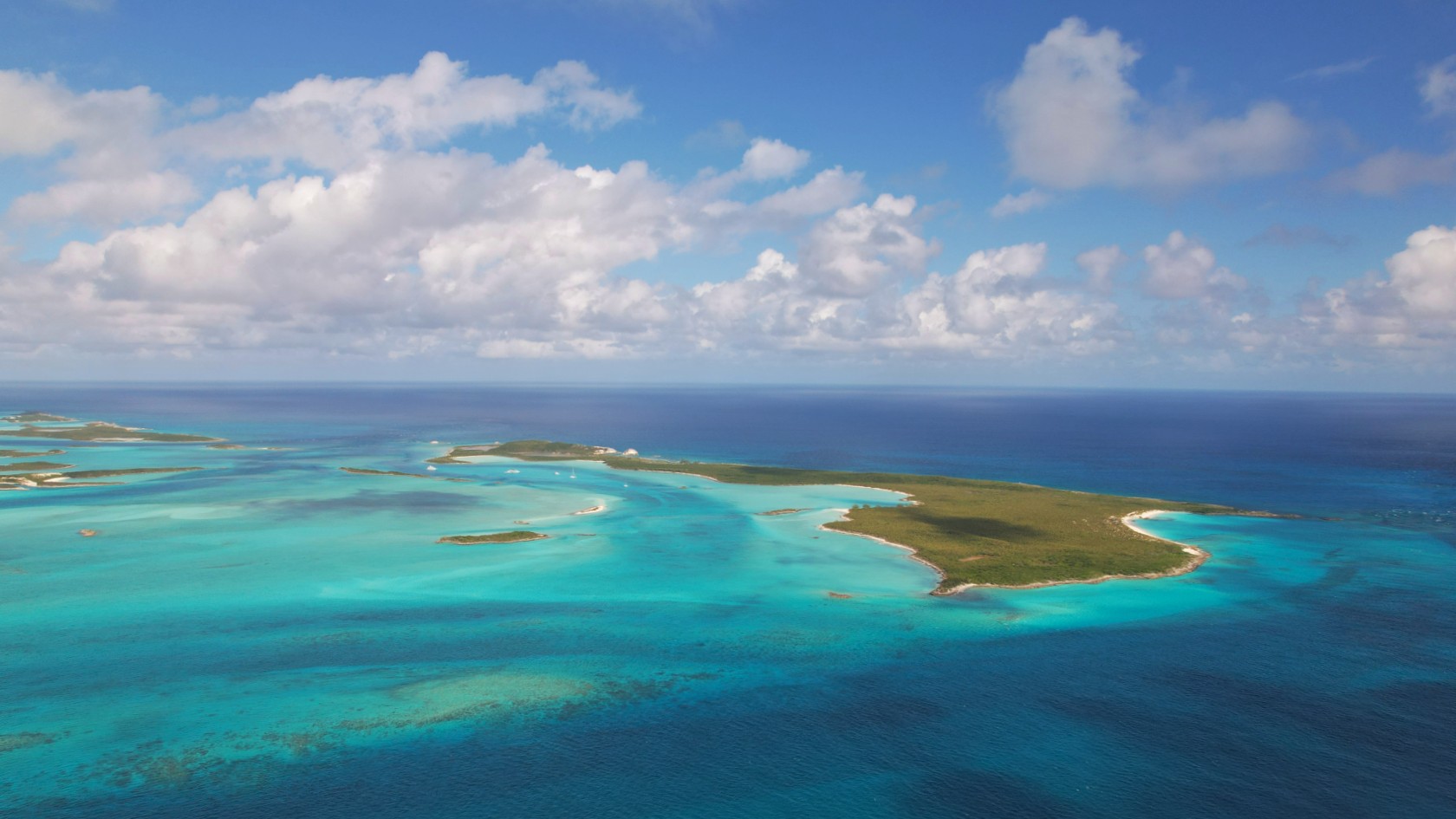 Discover Cambridge Cay in the Exuma Cays Land and Sea Park. Enjoy protected mooring, snorkeling with rays and sharks, hiking trails, and nearby attractions.