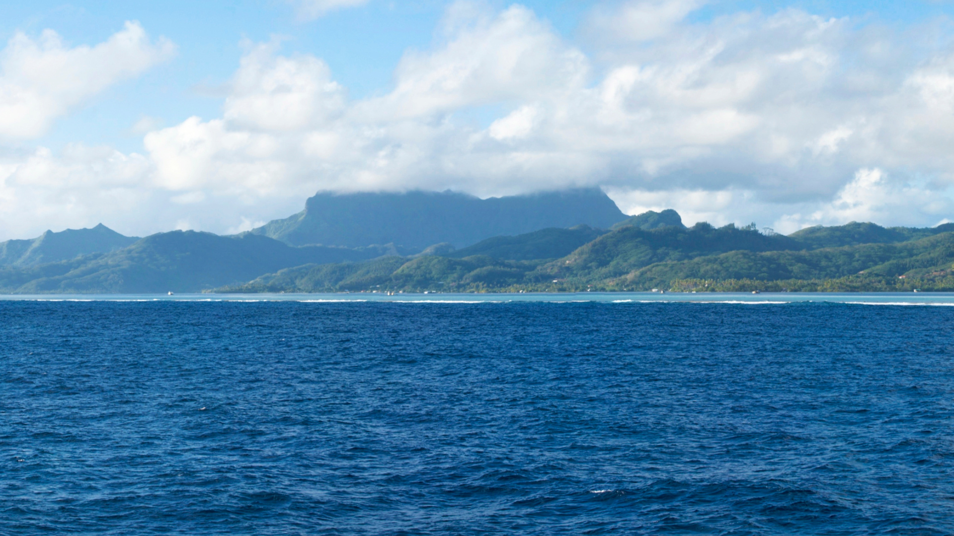 Anchor at Faaroa Bay, Raiatea, a serene spot surrounded by lush landscapes and calm waters.