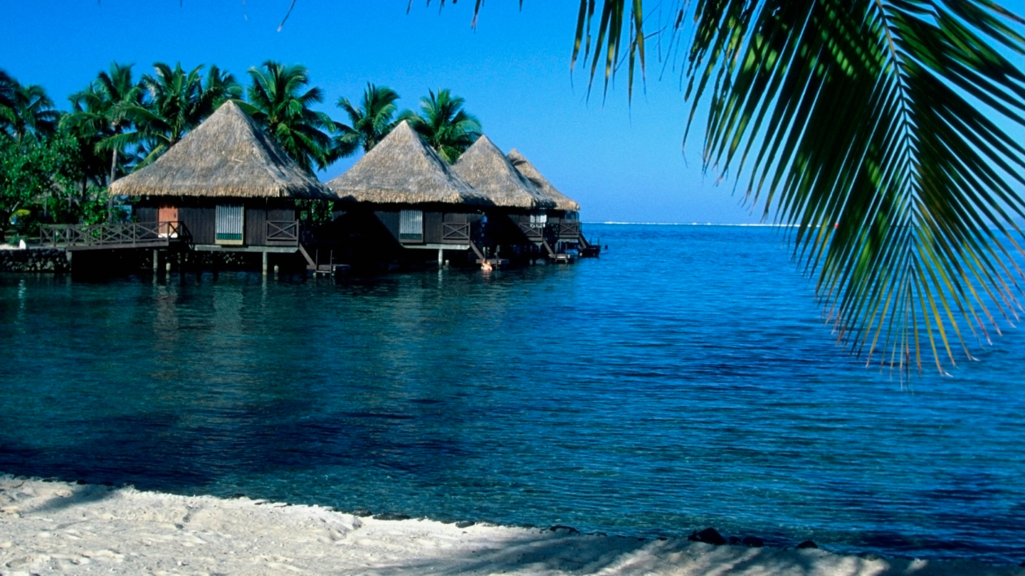Relax at Miri Miri Beach, Raiatea, a beautiful beach perfect for swimming and picnicking.