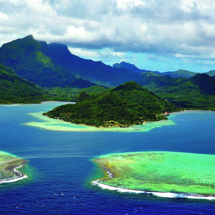 Visit Taputapuatea Marae, Raiatea, a UNESCO World Heritage site and ancient Polynesian religious center.