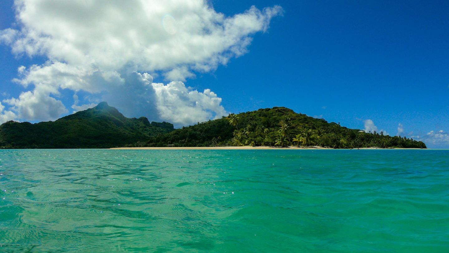 Tereia Beach, Maupiti, is a stunning white sand beach ideal for swimming, picnicking, and relaxation.