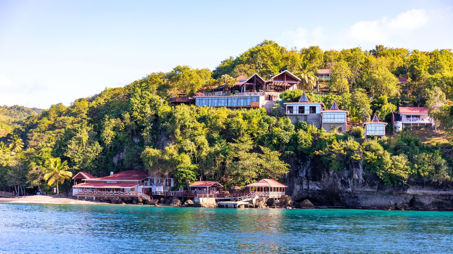 Snorkel and dive in the clear waters of Anse Cochon, St Lucia, a secluded bay home to fascinating shipwrecks and vibrant marine life.