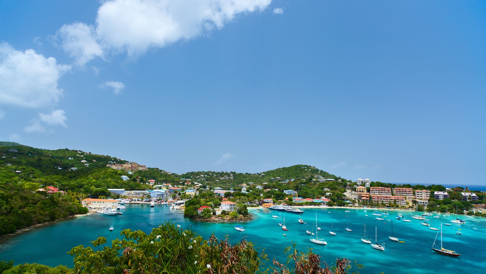 Cruz Bay, St. John, is your go-to for vibrant nightlife and provisioning during your USVI sailing adventure.