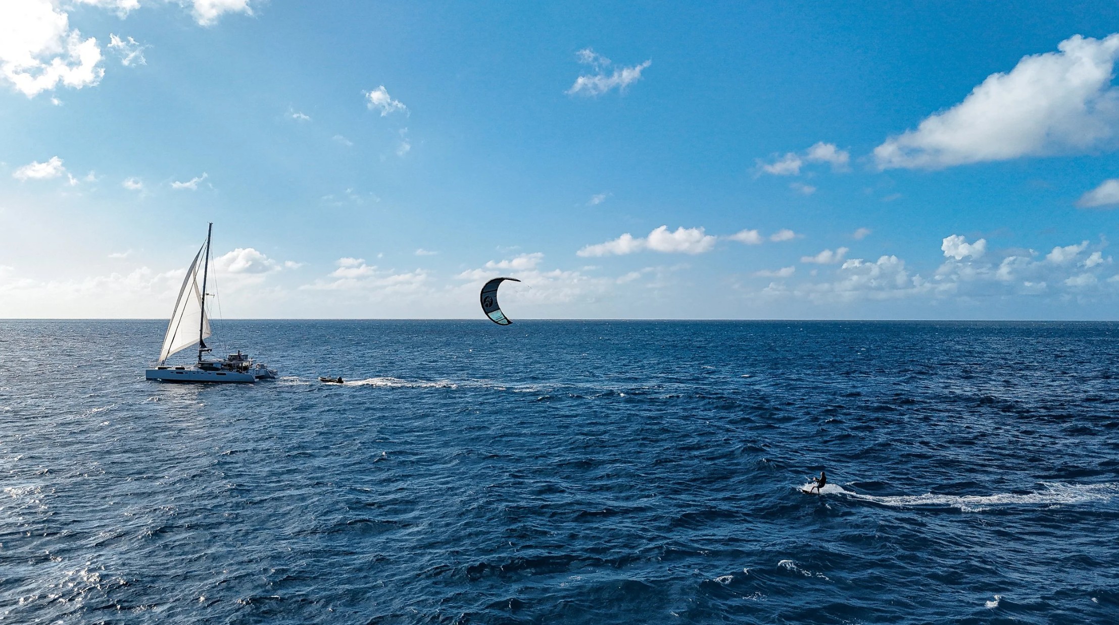 Kiteboarding yacht charter destinations ranked: Anegada's flats, the Grenadines, the Exumas, Anguilla's boat-only cays, and French Polynesia — plus wind seasons.