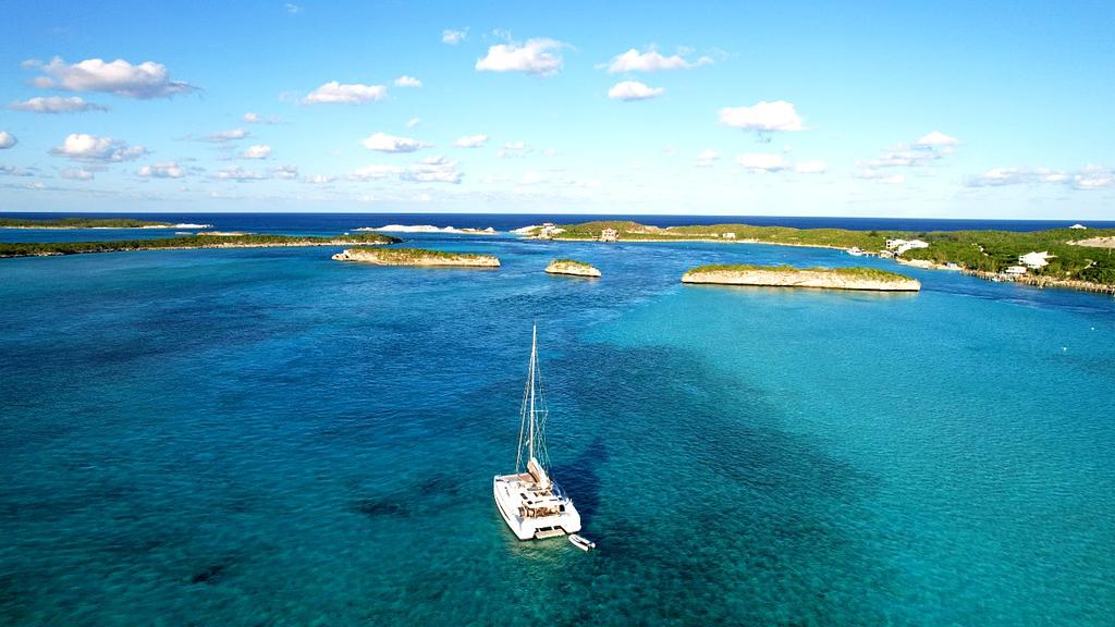 Anchorage near Staniel Cay with Thunderball Grotto in the background