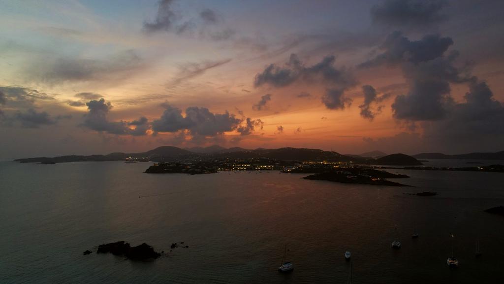 Epic year-round sunsets await - this one over St. Thomas at Christmas Cove