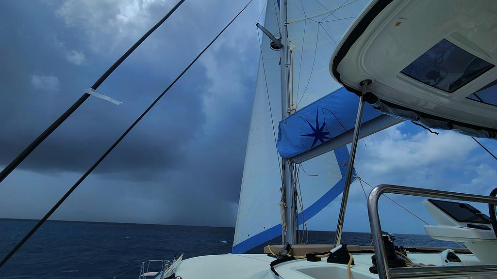 Our first reef is in the main and jib as we prepare to dodge some squalls north of Tortola