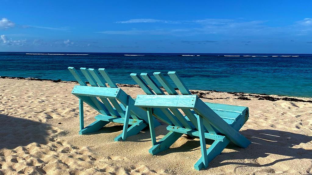 Relax on this beautiful beach overlooking the reef