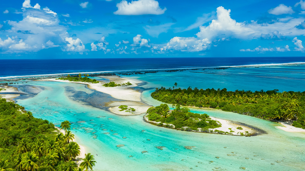Some of the many motus that define the lagoons of the Society Islands