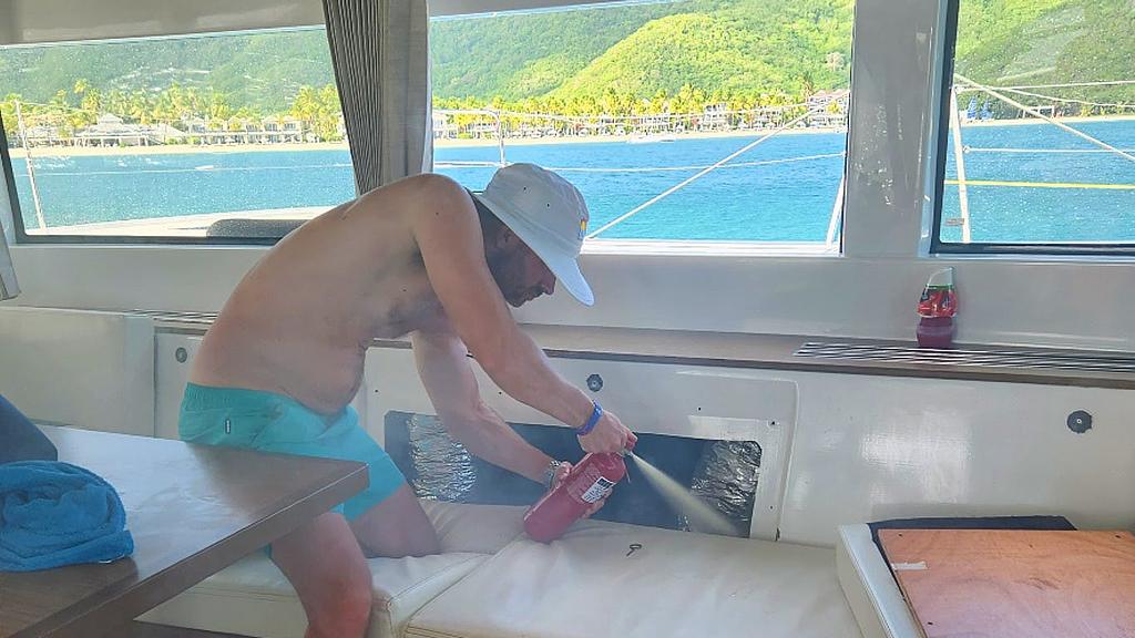 Putting out a small electrical fire on our Antigua charter trip