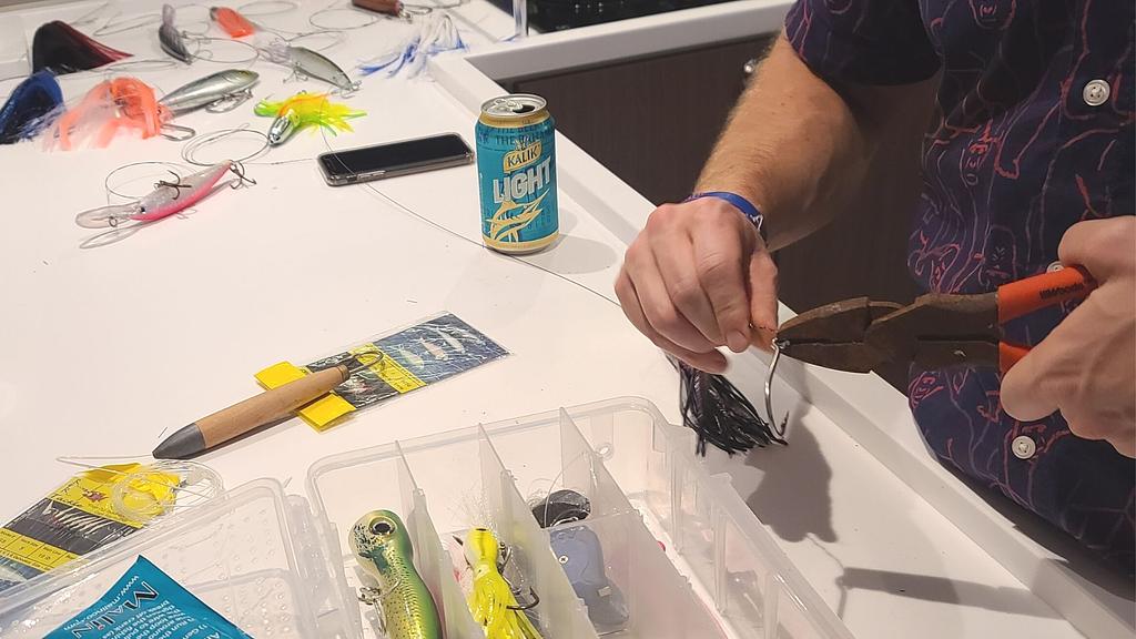Prepping lures for our trolling lines on our sleep aboard during a recent Exuma charter